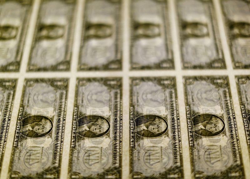 Dollar edges to fourteen day high versus euro as US finance information looms