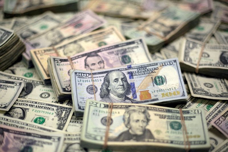 Dollar drops as information support blurs; Swiss franc acquires following rate cut